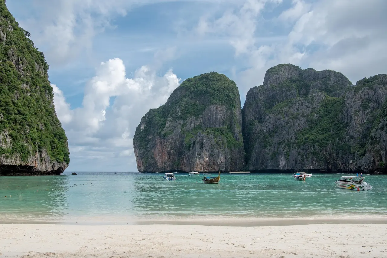 Beach enclosed by vertical limestone cliffs on Phi Phi Leh