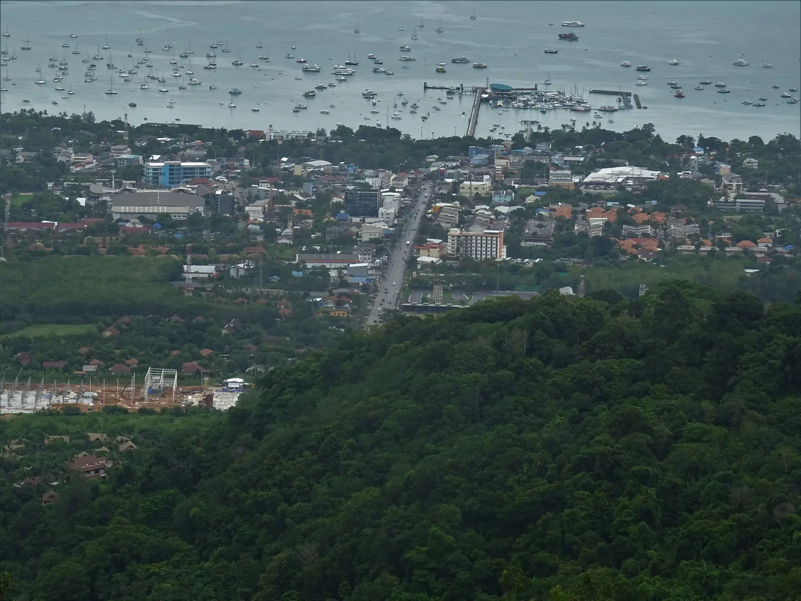 Wide anchorage bay with a long pier on the south coast of Phuket