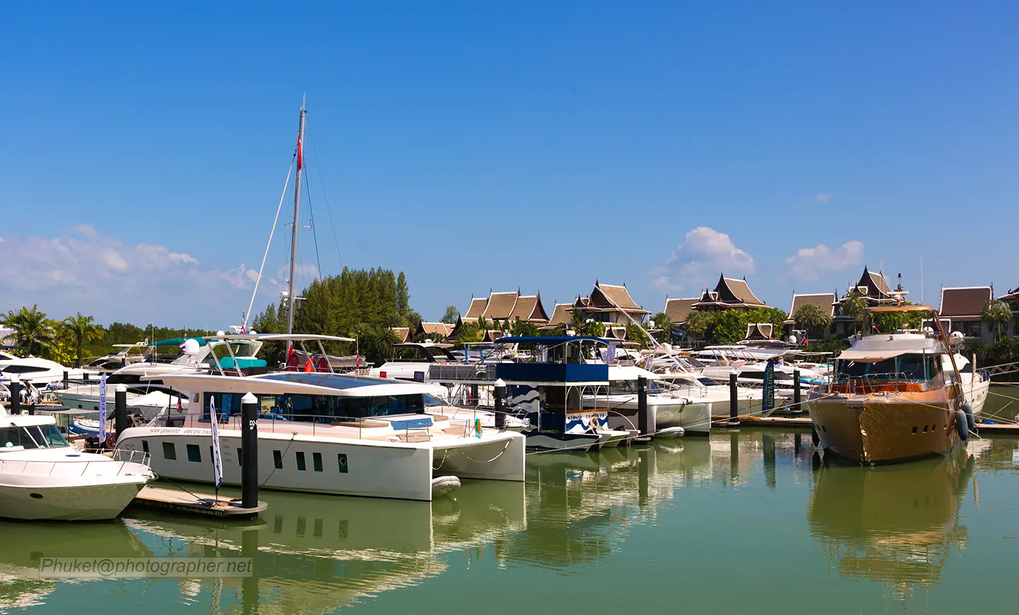 Marina quay with restaurants and motor yachts alongside