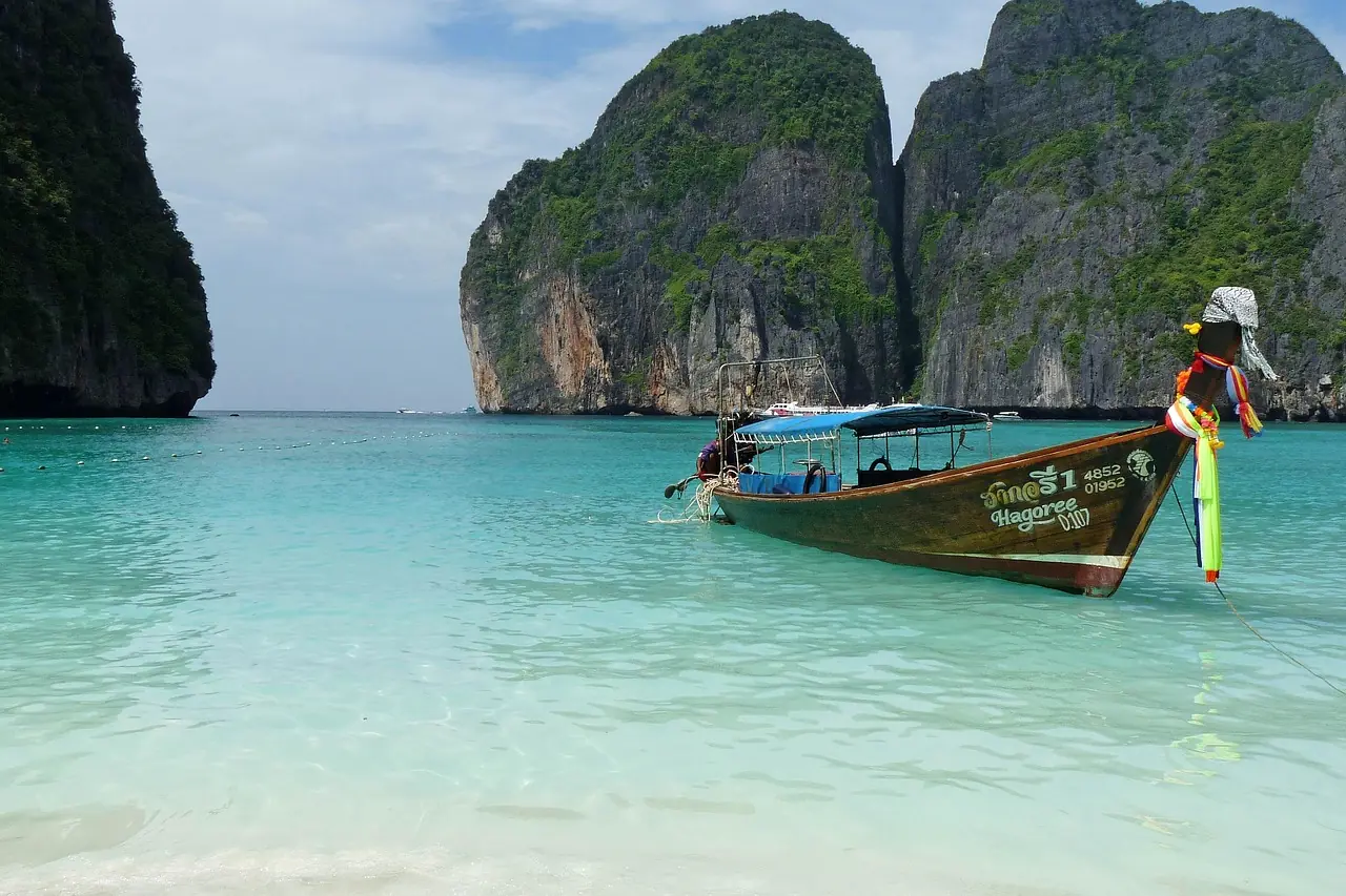 Sailing yacht under way between limestone islands in the Andaman Sea