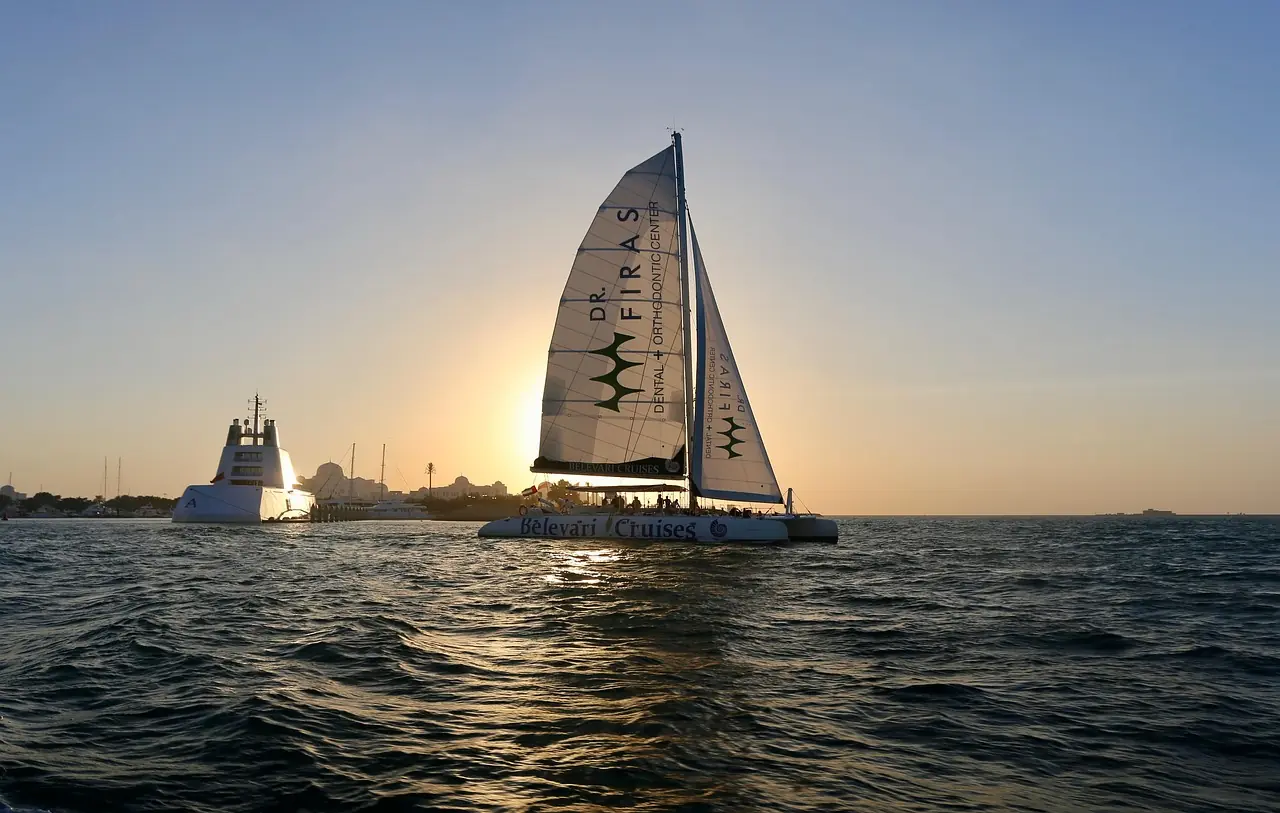 Sailing catamaran with a full main under way