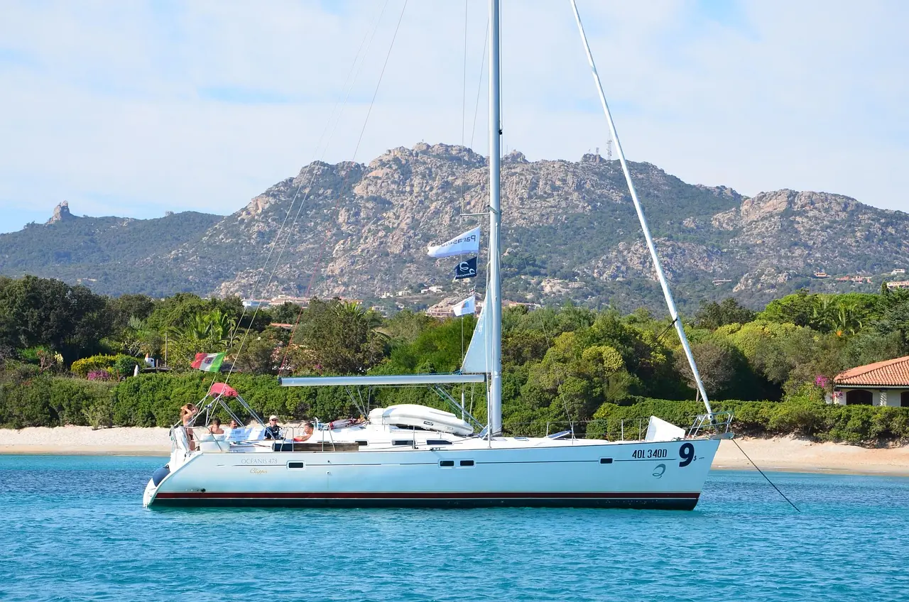 Monohull cruising yacht at anchor in a limestone bay
