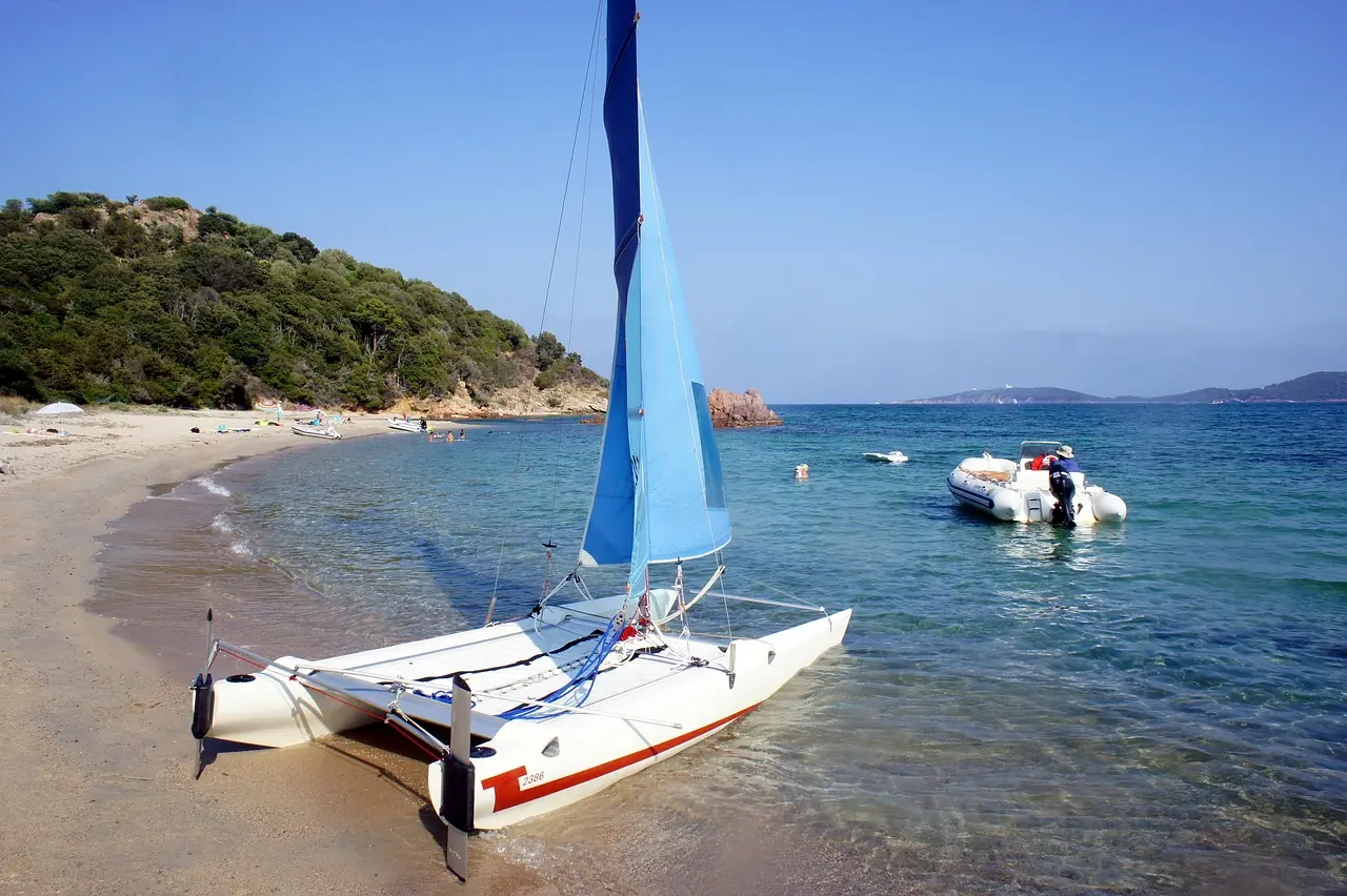Bareboat charter catamaran with forward cockpit at anchor