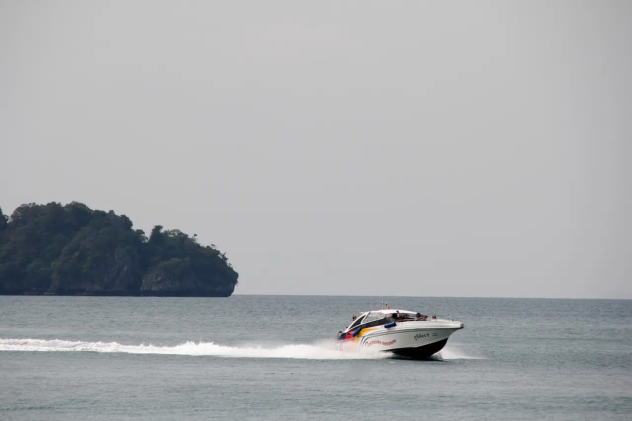 A 37 metre motor superyacht at anchor in tropical water